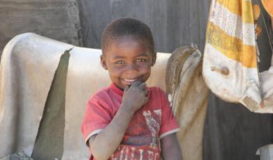 Young Boy living on the rubbish dump outside Toekomsrus